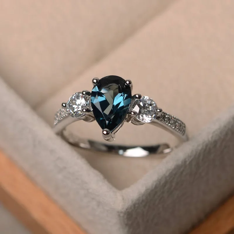 Unique Diamond Wedding Bands For Fashion-Forward Couples-Always Mine London Blue Topaz Ring